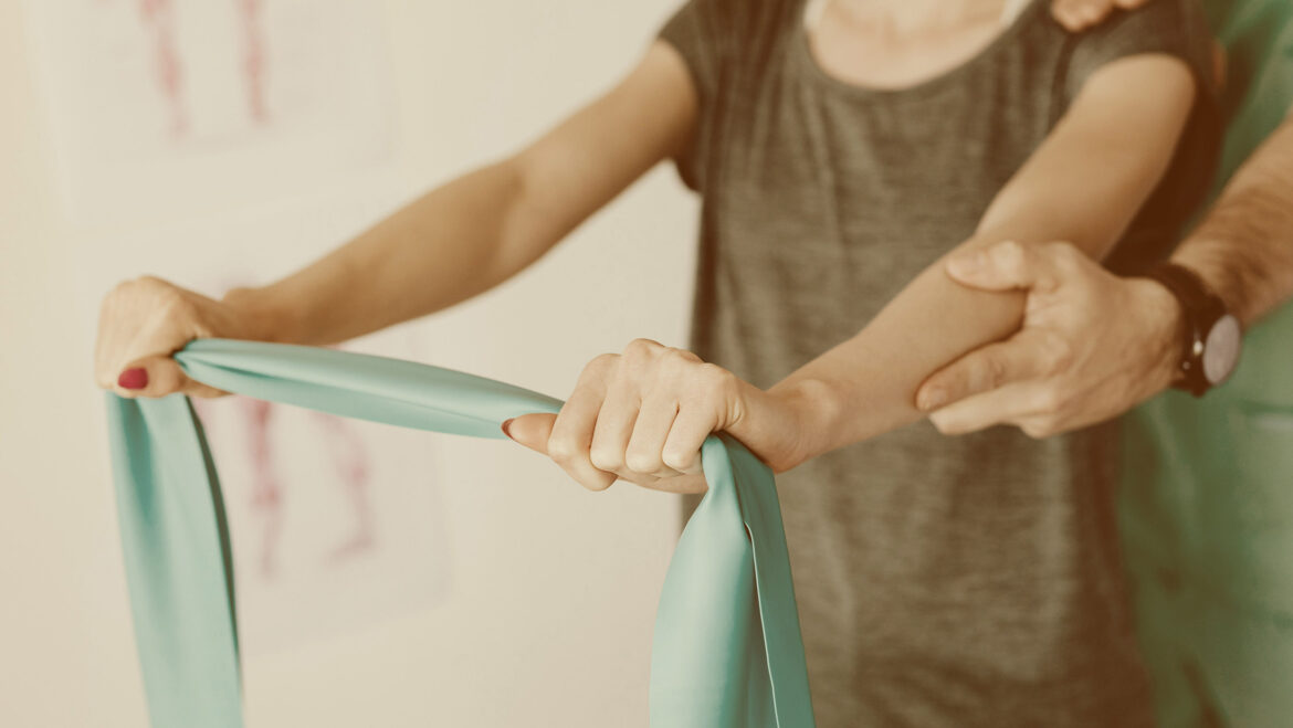lady using resistance band for shoulder health